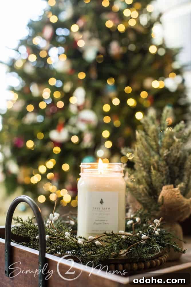 13 Timeless Neutral Christmas Decorating Ideas for Your Home 7 candle in wood tray in front of christmas tree