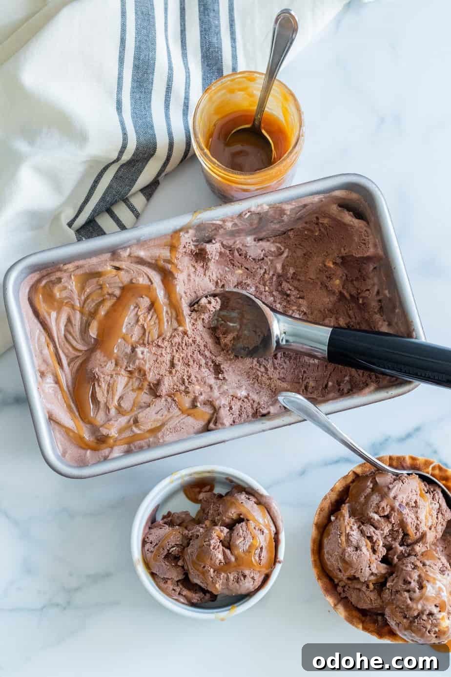 chocolate ice cream in a loaf pan with ice cream scoop