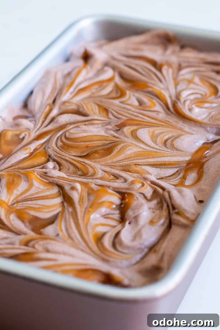 close up of chocolate ice cream with caramel swirls