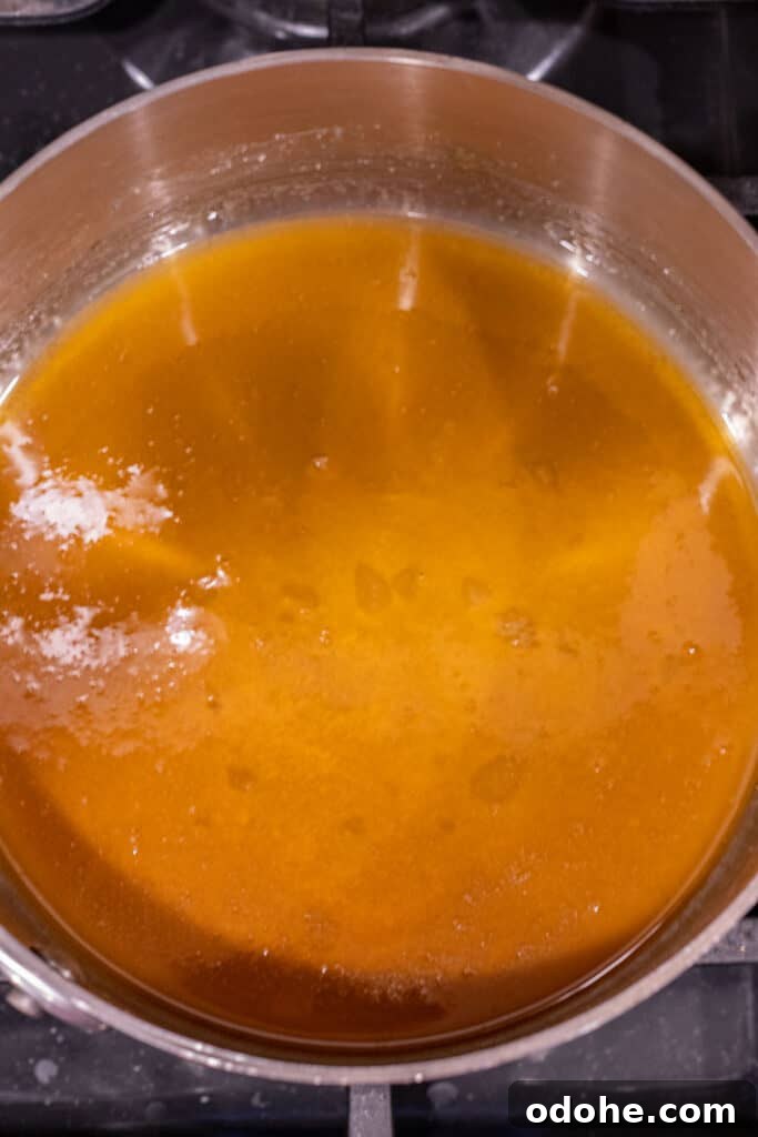 golden brown melted sugar in a saucepan