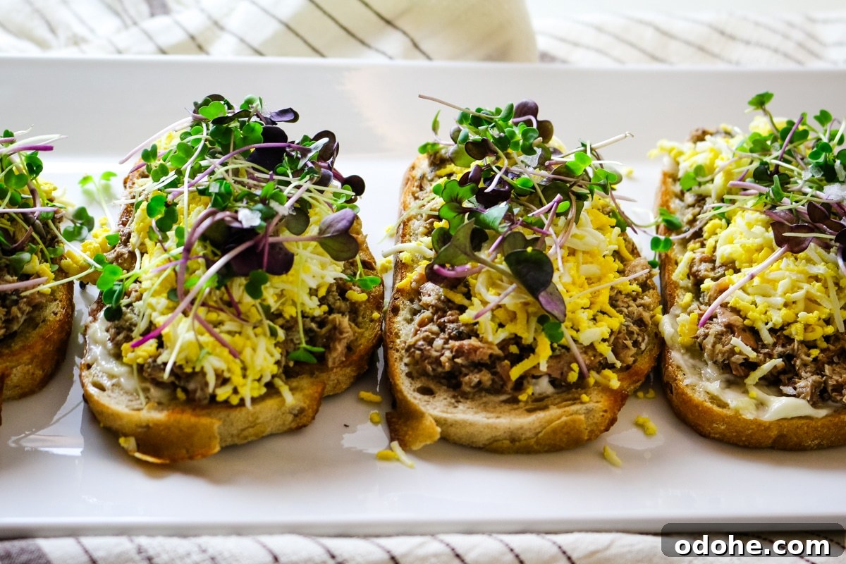 Sardine and Egg Toast Recipe for Brunch or Quick Meals 12 Sardine toast on a white plate.