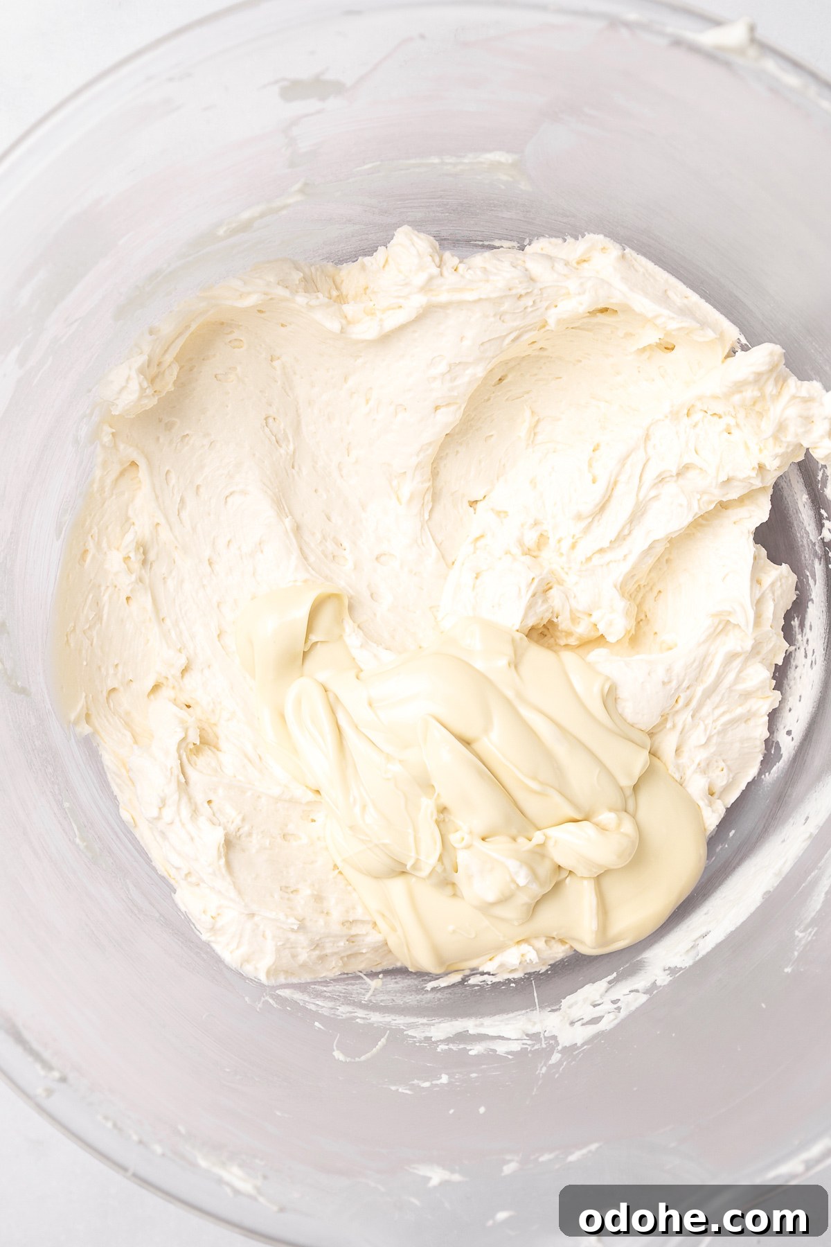 white chocolate buttercream frosting with melted white chocolate added