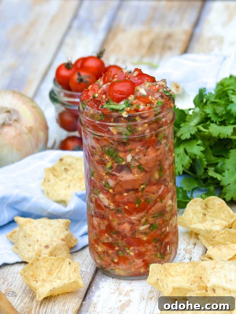 garden fresh tomato salsa in a tall glass jar