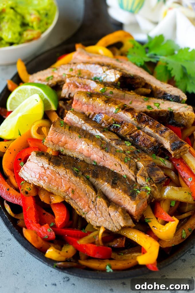Steak Fajitas Recipe | Beef Fajitas | Steak Recipe #fajitas #steak #beef #mexicanfood #dinner #dinneratthezoo Steak fajitas served on a bed of seared peppers and onions.