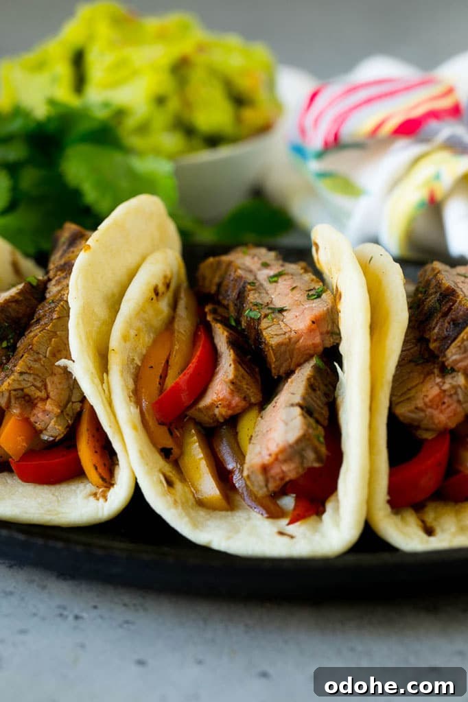 Steak Fajitas Recipe | Beef Fajitas | Steak Recipe #fajitas #steak #beef #mexicanfood #dinner #dinneratthezoo Tortillas filled with steak and sauteed peppers and onions.
