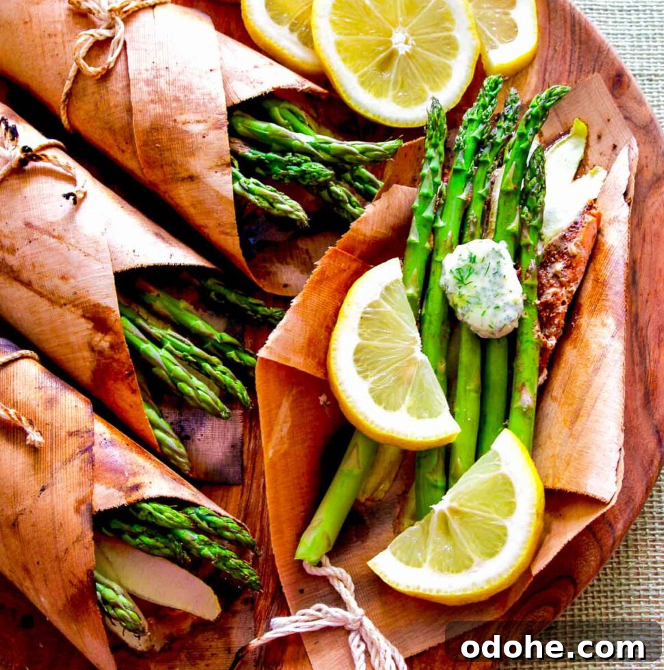 Cedar-Plank Grilled Salmon: Smoky Summer Recipe for Outdoor BBQ 15 A wooden platter with cedar wrapped salmon, asparagus, and lemon butter.