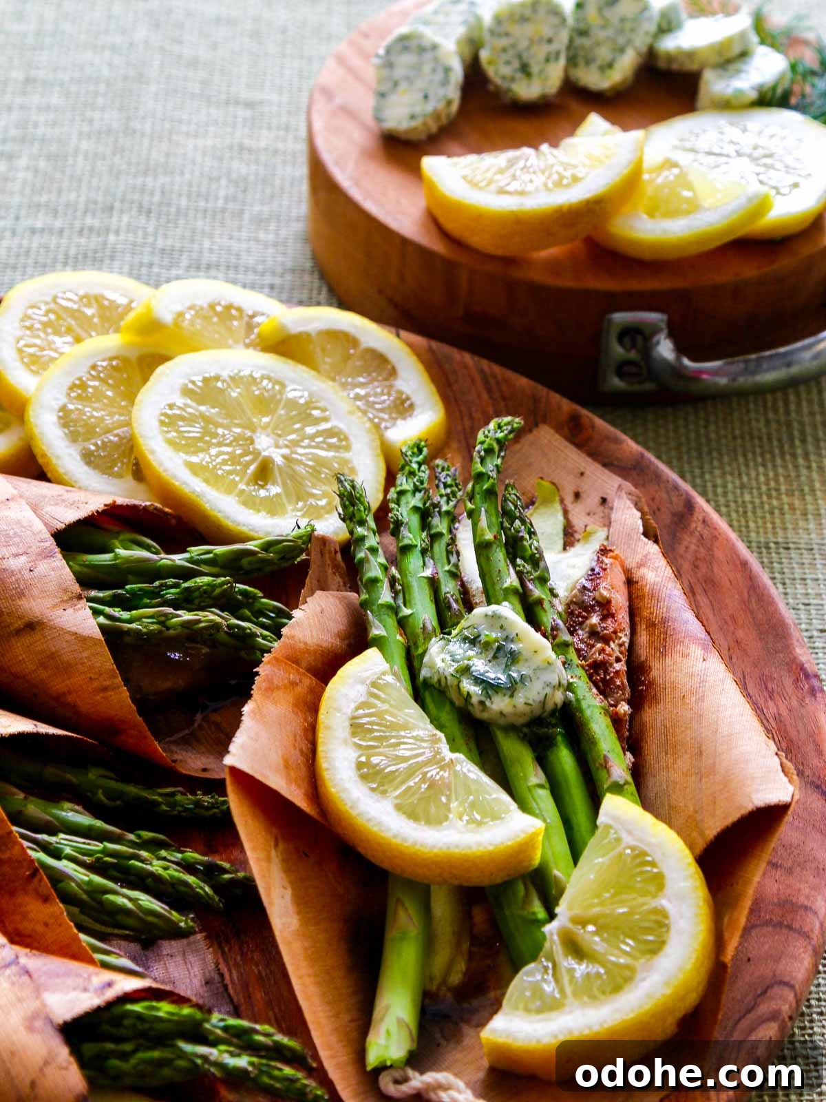 Cedar-Plank Grilled Salmon: Smoky Summer Recipe for Outdoor BBQ 9 Melting lemon dill butter on salmon and asparagus