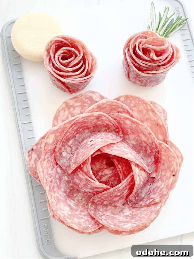Create a Salami Rose: Step-by-Step Guide for Party Platters 2 cutting board with a completed large salami rose and two smaller salami rosebuds