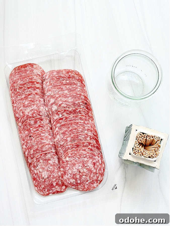 Create a Salami Rose: Step-by-Step Guide for Party Platters 4 ingredients for making a salami rose - salami, glass, toothpicks