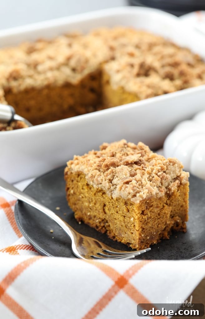 Slice of pumpkin crumb cake on a plate.