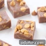 Easy chocolate peanut butter fudge cut in squares.