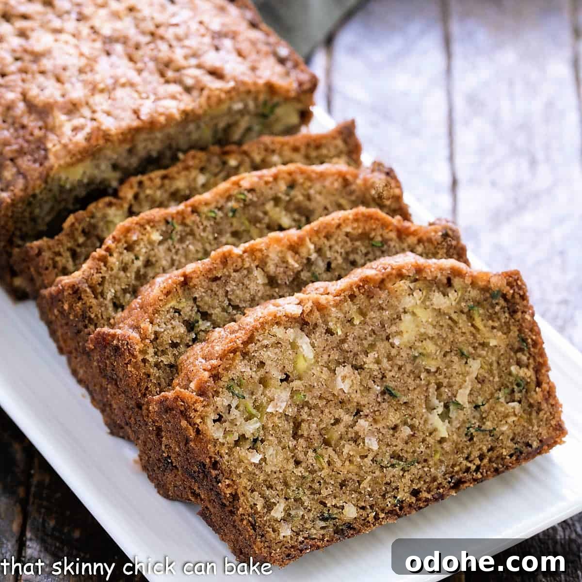 Pineapple Coconut Zucchini Bread - The ultimate summer quick bread with walnuts, pineapple and coconut! Zucchini Bread Recipe with Pineapple and Coconut.