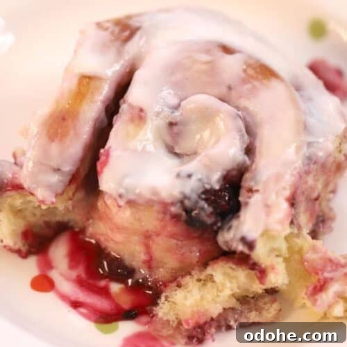 triple berry sweet roll with lemon icing