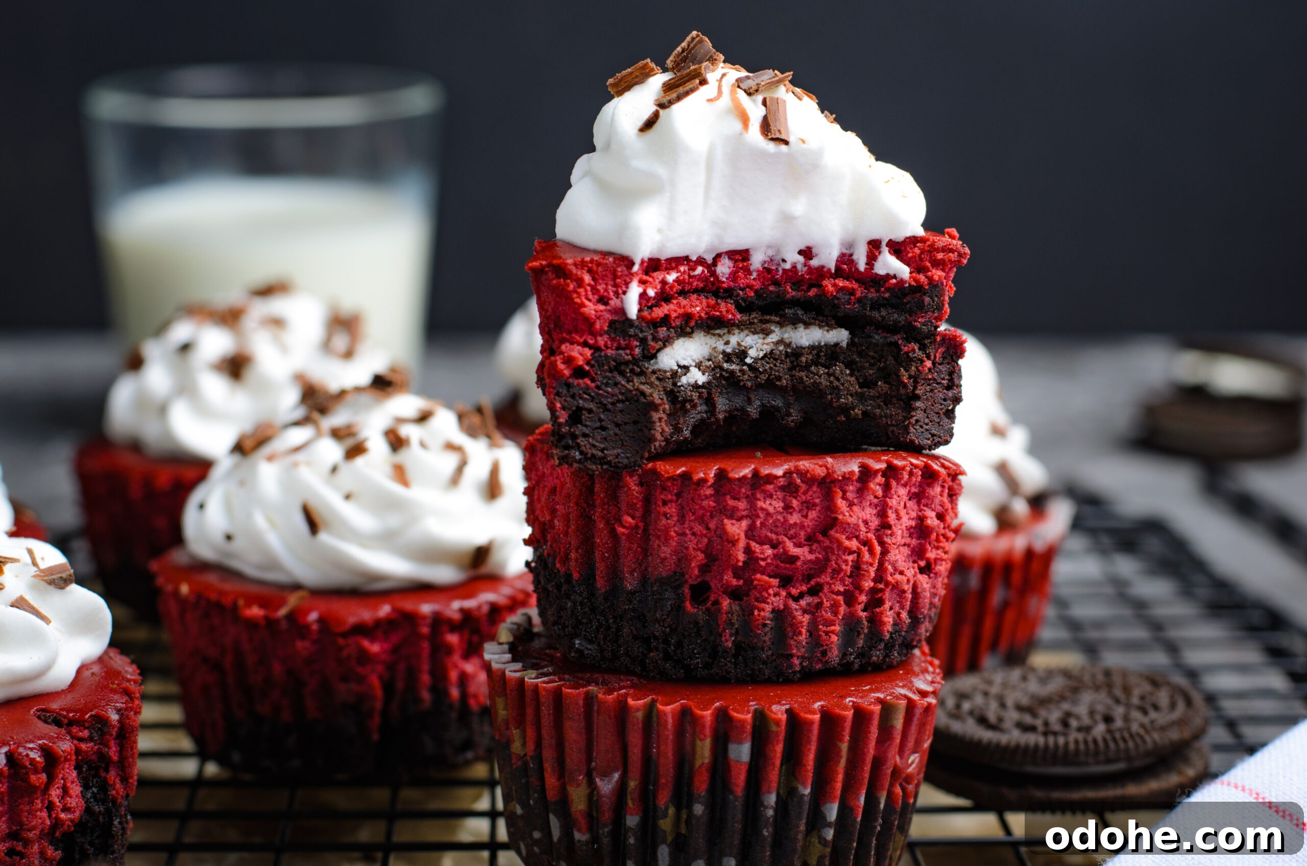 Mini Red Velvet Oreo Cheesecake Bites for Parties 2 Close up view of Mini Red Velvet Oreo Cheesecakes stacked with a bite missing from the top one