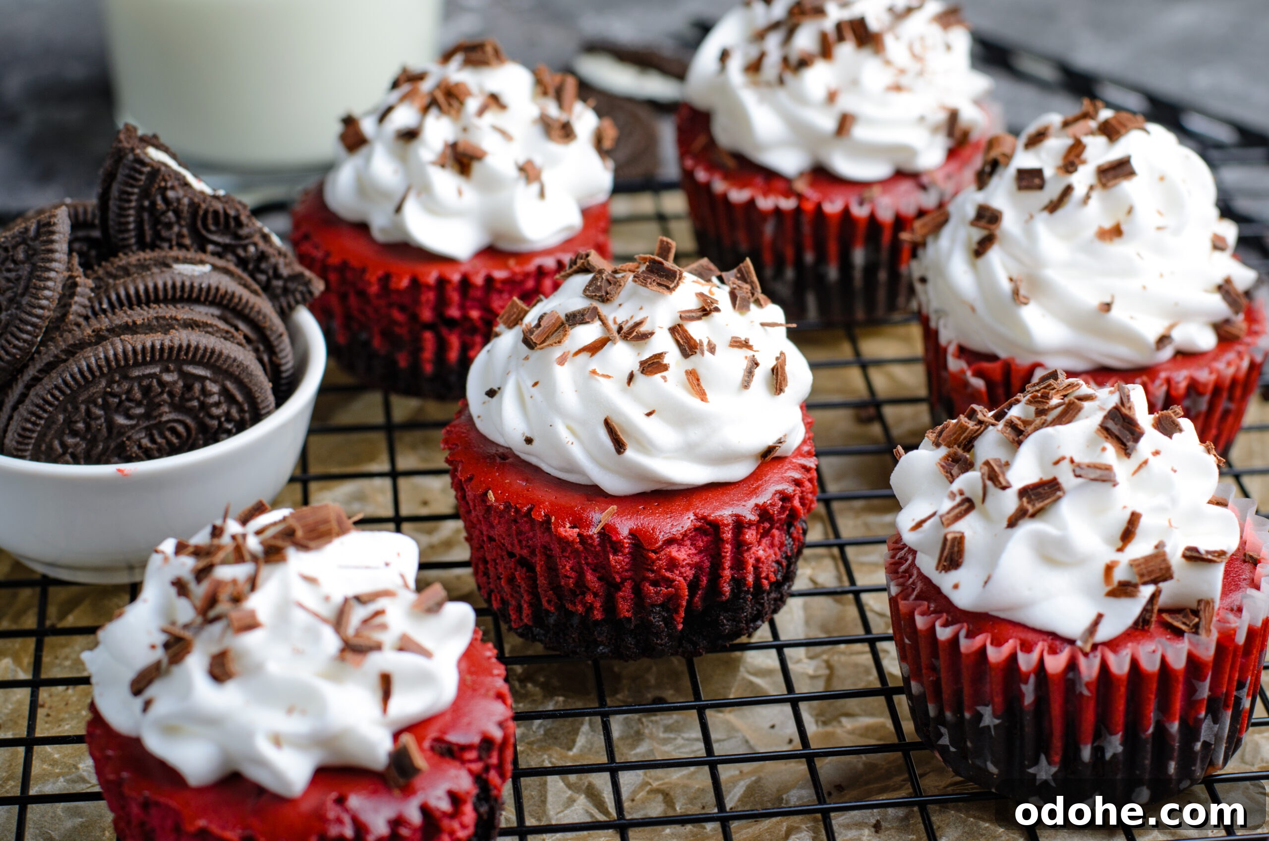 Mini Red Velvet Oreo Cheesecake Bites for Parties 19 Mini Red Velvet Oreo Cheesecakes on a wire rack