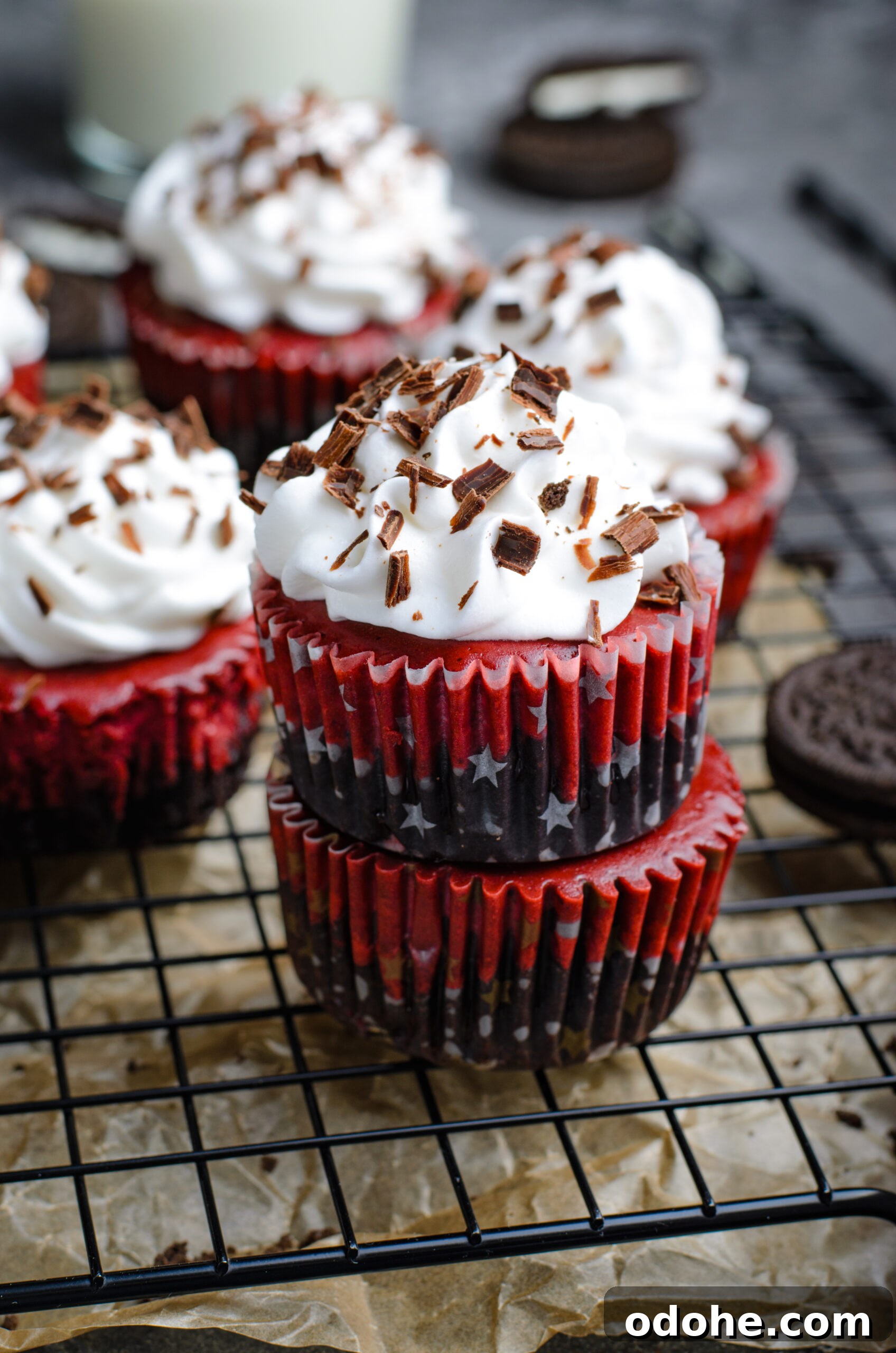 Mini Red Velvet Oreo Cheesecake Bites for Parties 8 Front view of three Mini Red Velvet Oreo Cheesecakes stacked.