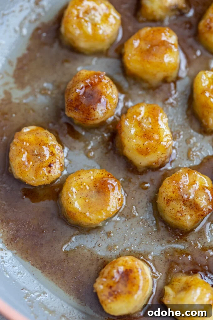 How to Make Perfect Caramelized Bananas for Desserts and Toppings 3 caramelized bananas cooking on a skillet