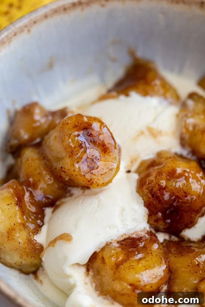 How to Make Perfect Caramelized Bananas for Desserts and Toppings 5 caramelized bananas served over a scoop of vanilla ice cream