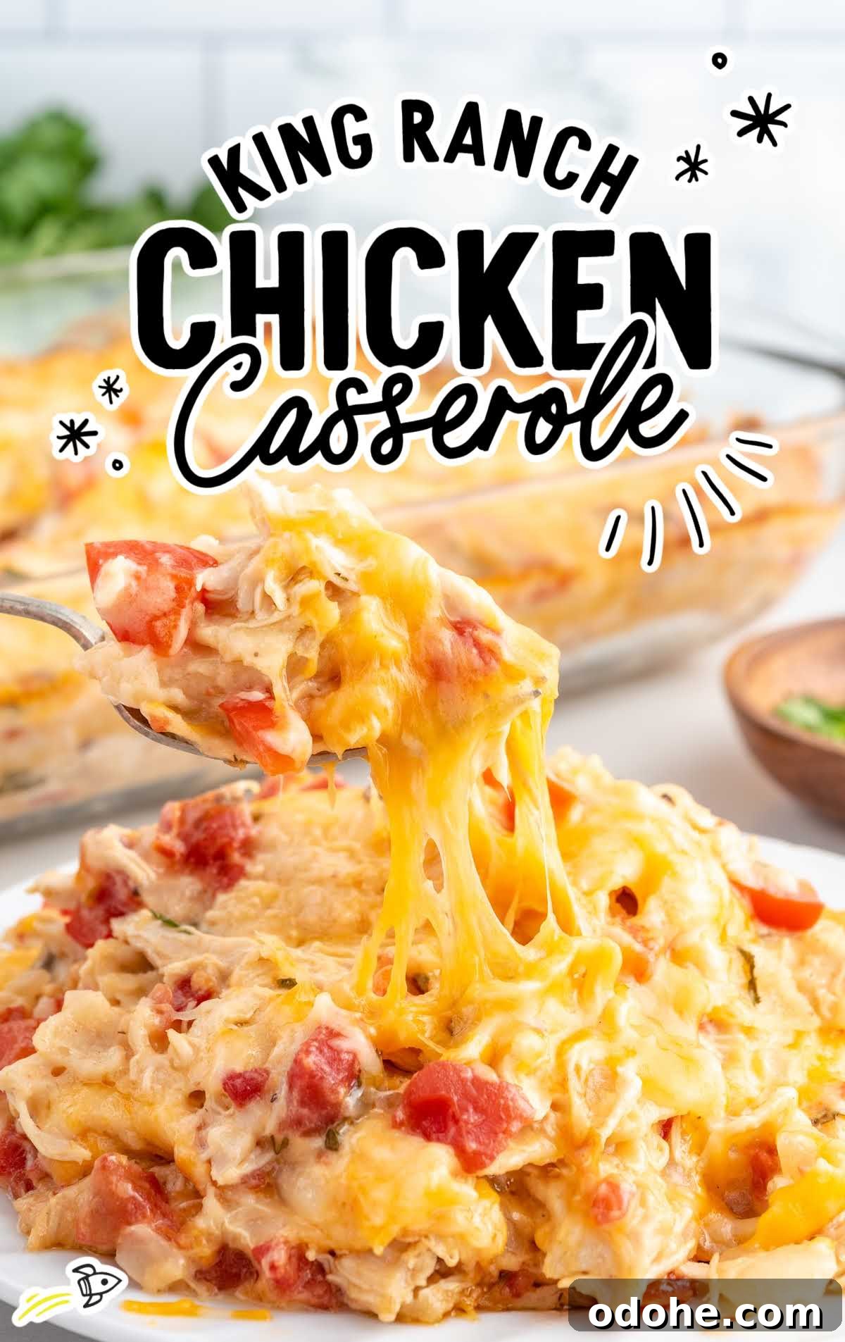 a close up shot of King Ranch Chicken Casserole on a plate with a fork grabbing a piece