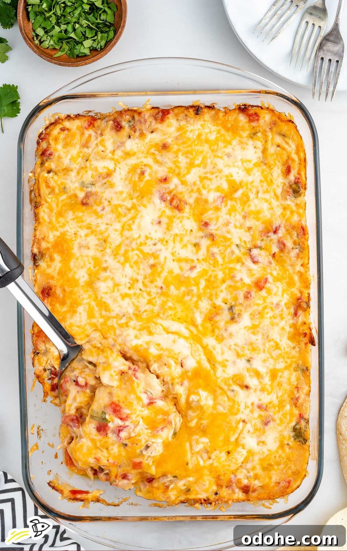 a close up shot of King Ranch Chicken Casserole with a spatula grabbing a piece
