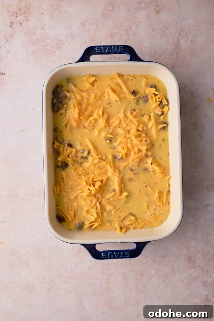 Tater Tot Breakfast Casserole Recipe for Brunch Crowd 7 The egg mixture is poured over the sausage.
