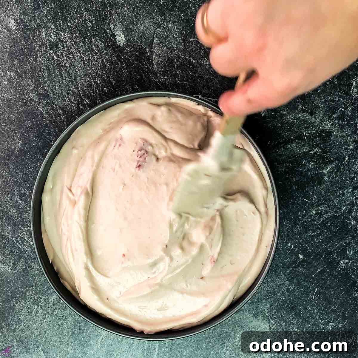 Creamy No-Bake Strawberry Cheesecake Recipe for Summer Serving 7 Spread the strawberry cream evenly with a spatula.