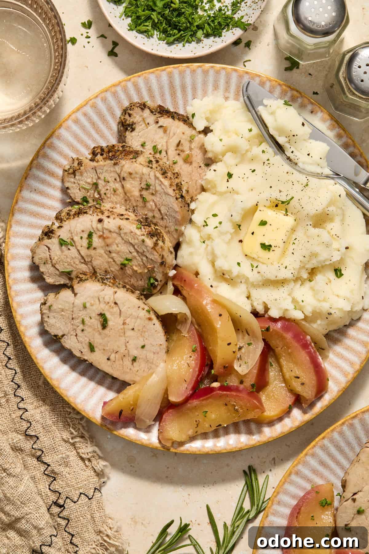 Perfect Instant Pot Pork Tenderloin Recipe for Juicy Results 2 Plate with instant pot pork tenderloin, cooked apples and mashed potatoes.