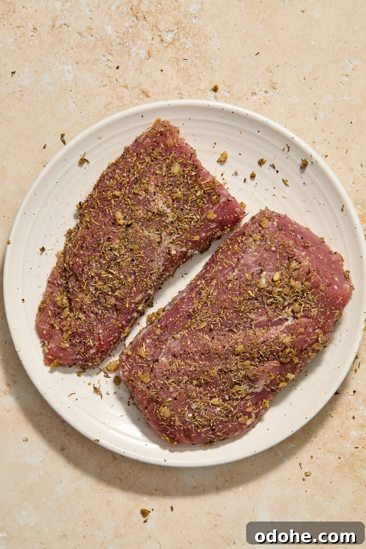 Perfect Instant Pot Pork Tenderloin Recipe for Juicy Results 6 Seasoned pork tenderloin on plate.