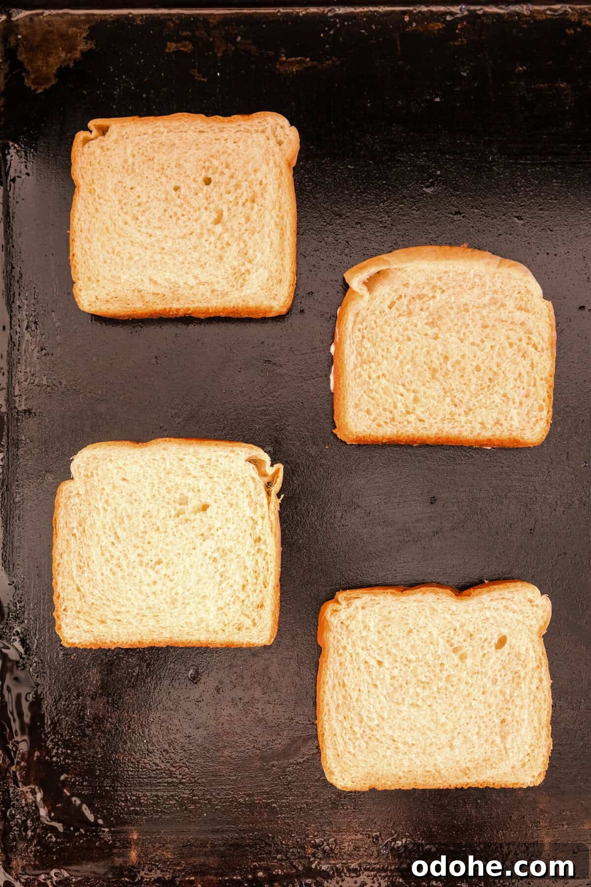 Perfect Grilled Cheese on a Blackstone Griddle: Melted & Crispy 5 Mayonaise side of bread faced down on Blackstone griddle for Blackstone Grilled Cheese recipe