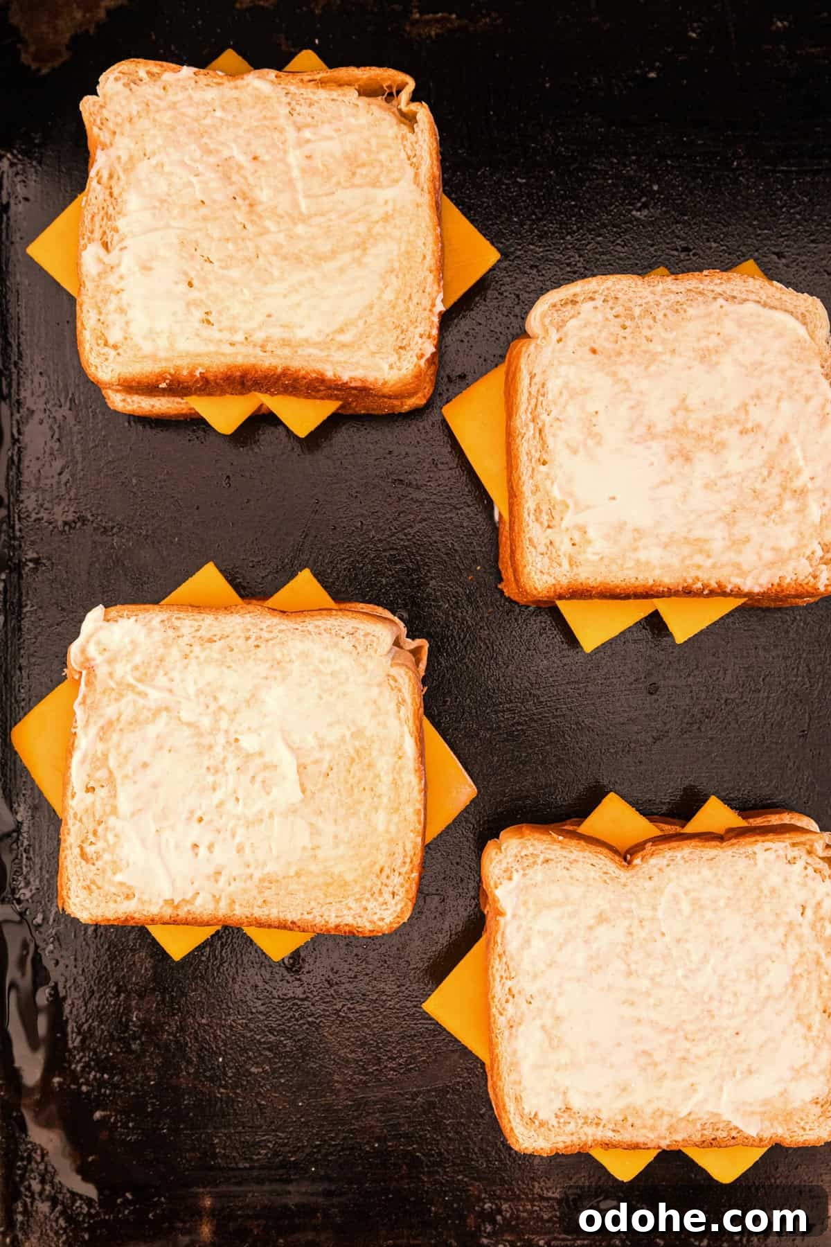 Perfect Grilled Cheese on a Blackstone Griddle: Melted & Crispy 7 Finishing out Blackstone Grilled Cheese stack with another piece of Mayonaise spread on bread pieces
