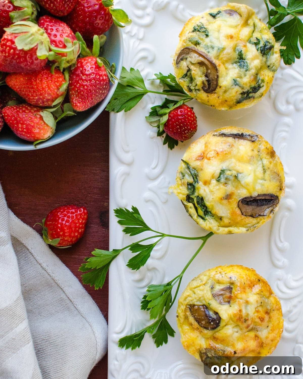 Spinach and Mushroom Mini Frittatas for Quick Breakfasts 8 Serving the mushroom and spinach egg bakes on a platter.