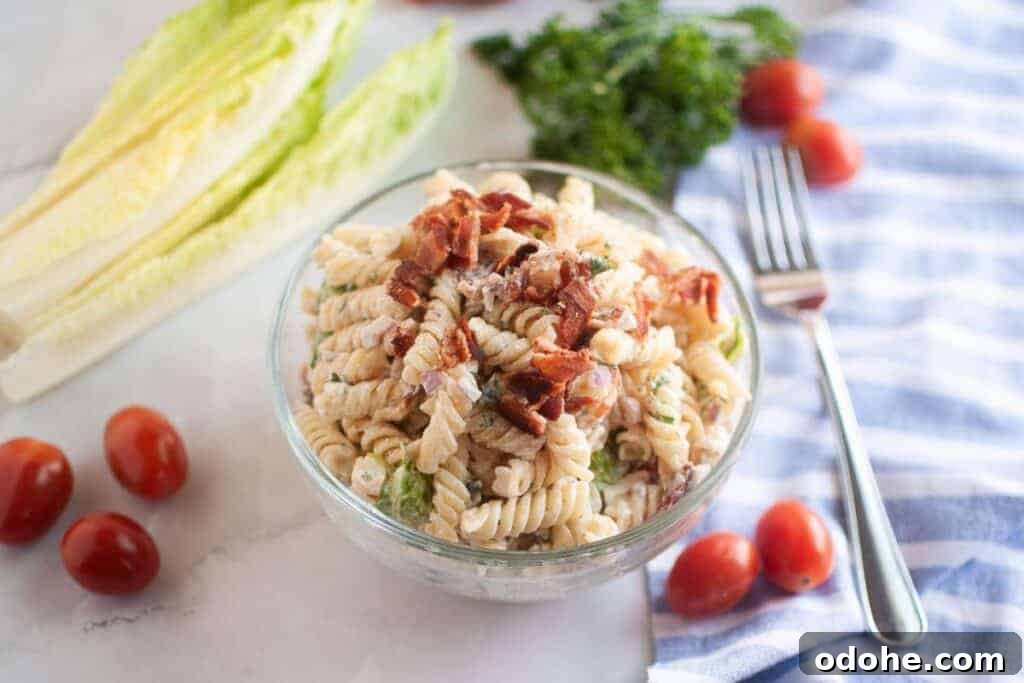 31 Memorial Day Recipes to Start Cookout Season Right 15 Overhead shot of a glass bowl filled with BLT pasta salad.