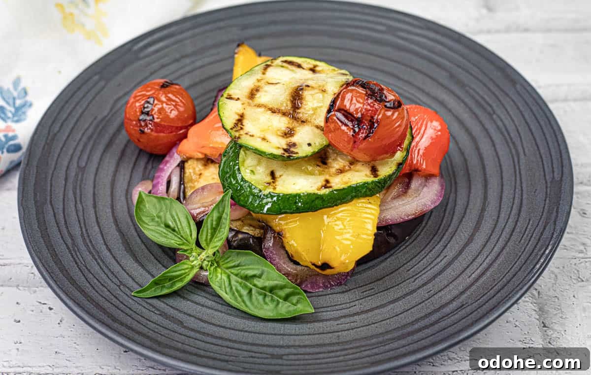 31 Memorial Day Recipes to Start Cookout Season Right 26 Close-up shot of Grilled Ratatouille on a black plate.