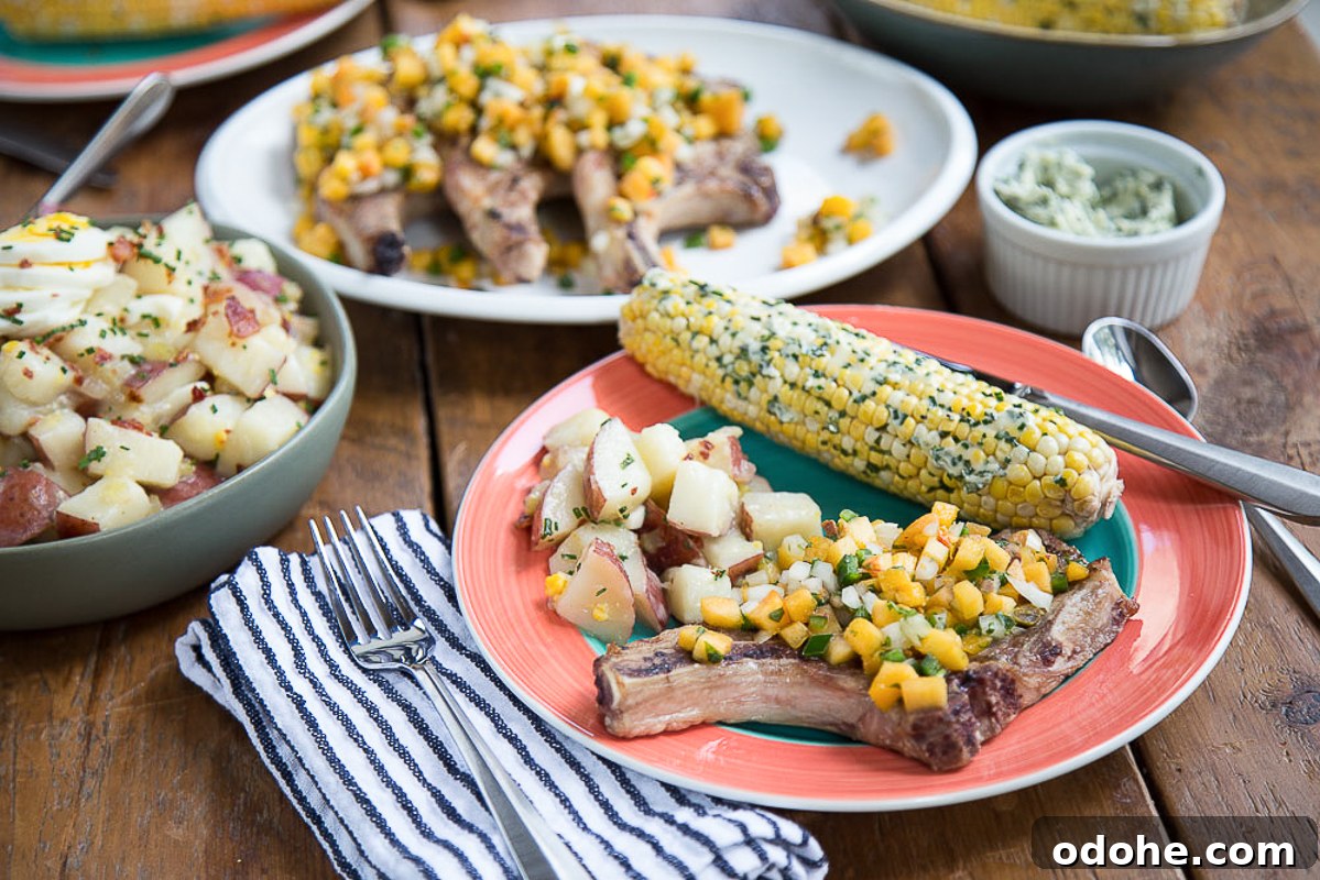Authentic German Potato Salad with Hard-Boiled Eggs & Bacon 13 summer meal with pork chops, corn, and potato salad on a wooden table