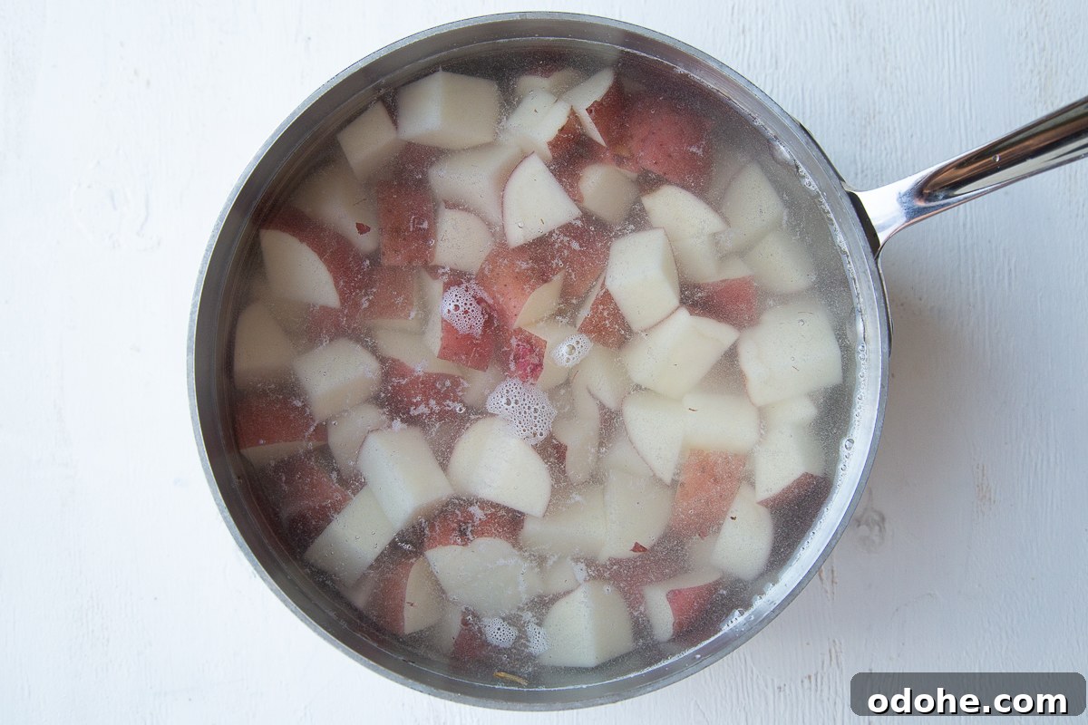 Authentic German Potato Salad with Hard-Boiled Eggs & Bacon 5 diced red potatoes in a pot of water