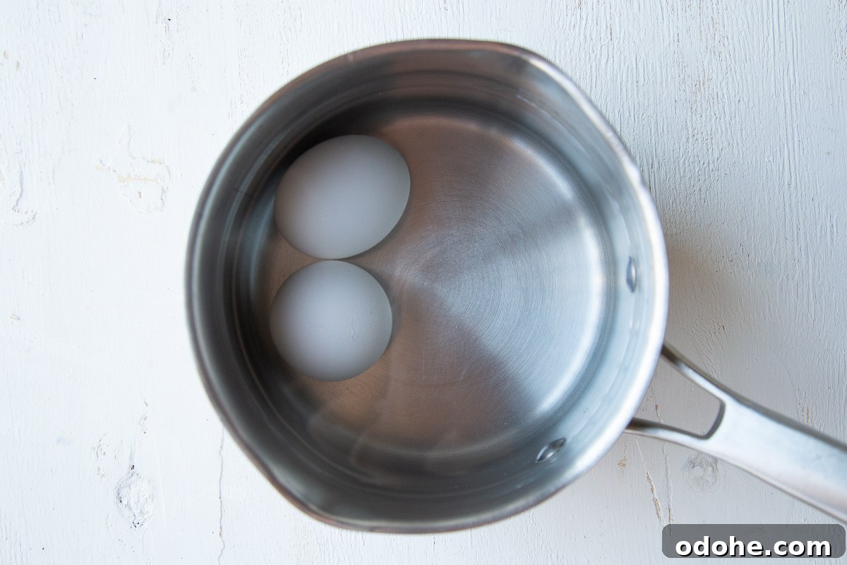 Authentic German Potato Salad with Hard-Boiled Eggs & Bacon 6 two eggs in a small saucepan, covered with water