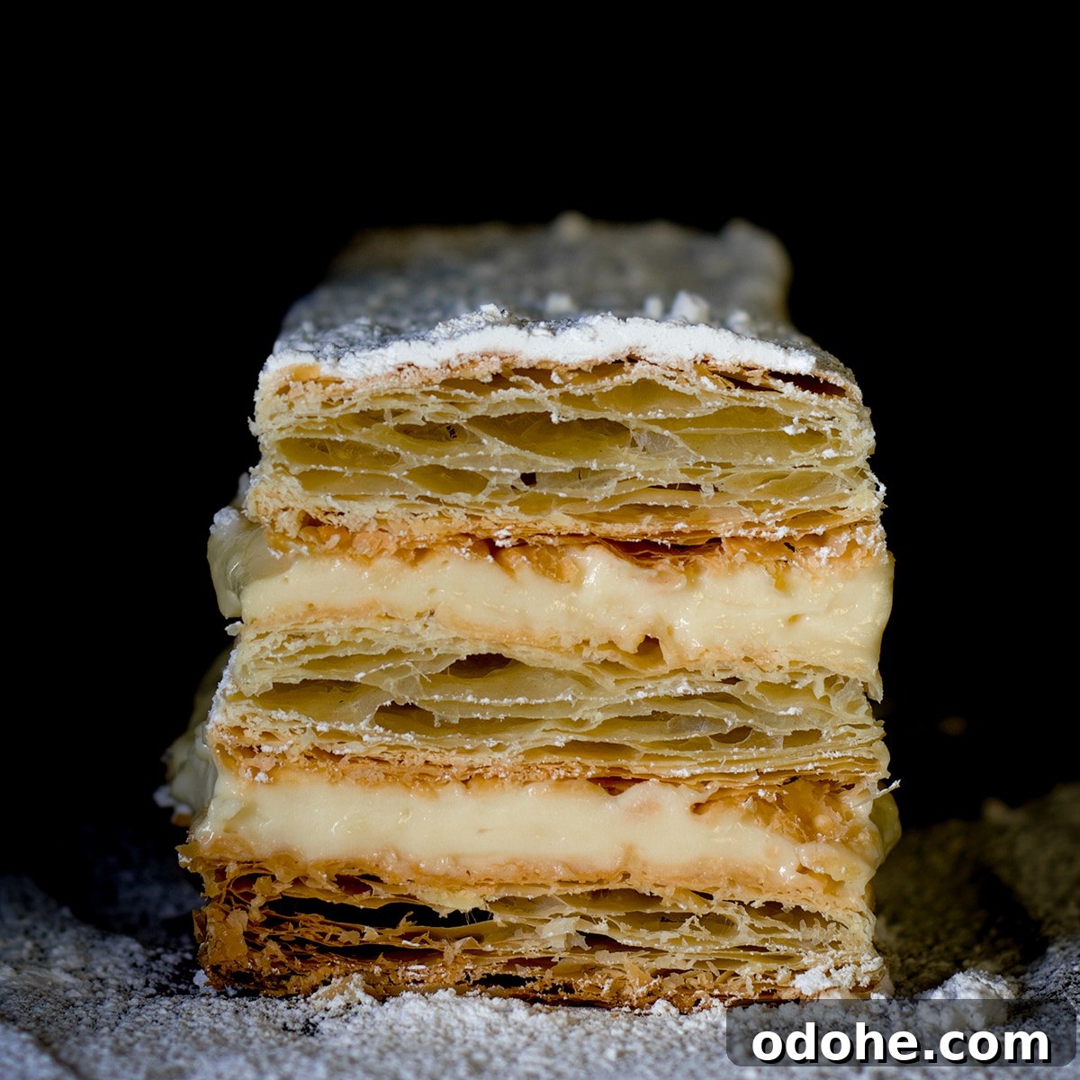 Mille-Feuille (Napoleon) Cream Pastry Recipe — Classic French Dessert 3 A classic French Napoleon that's been cut in half.