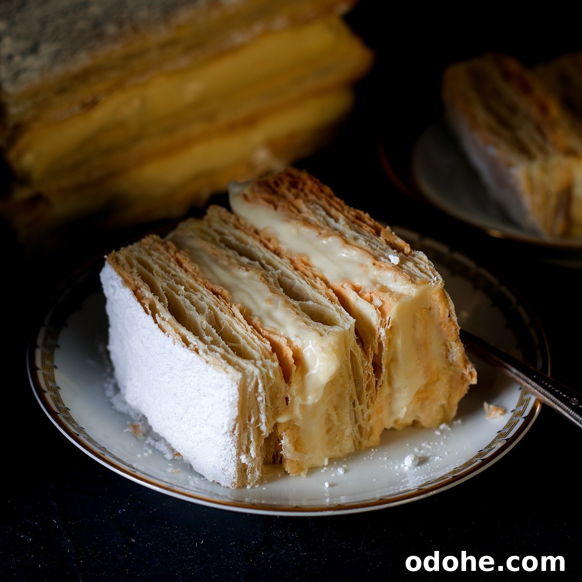 Mille-Feuille (Napoleon) Cream Pastry Recipe — Classic French Dessert 4 A slice of a napoleon dessert on a plate with a fork.