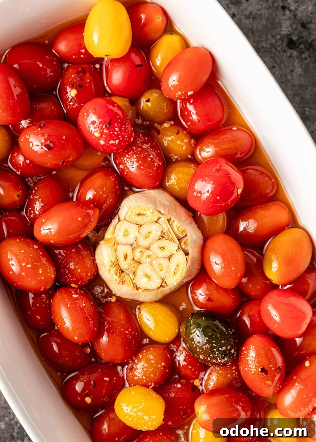 Slow-Roasted Cherry Tomato Confit Recipe for Flavorful Dishes 3 overhead: my tomato confit recipe in a baking dish before baking