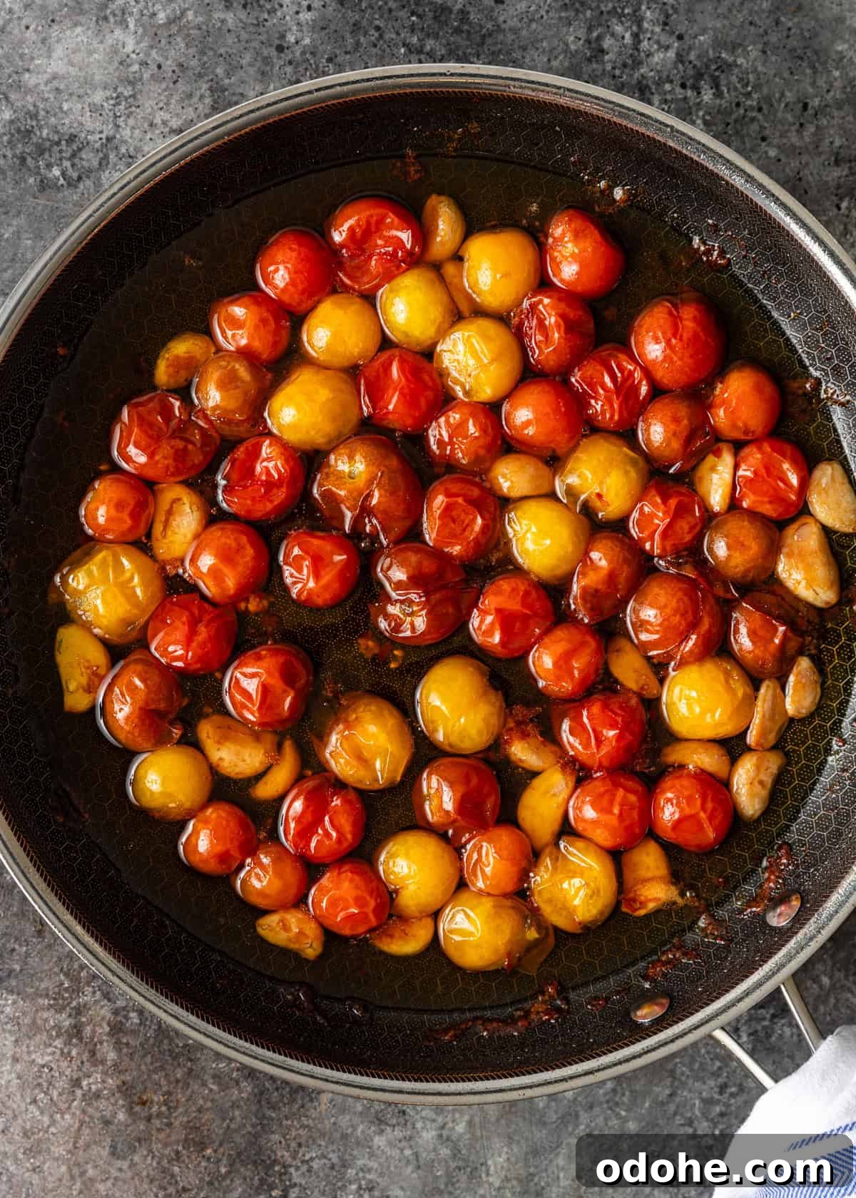 Slow-Roasted Cherry Tomato Confit Recipe for Flavorful Dishes 6 overhead: stovetop tomato confit after 1 hour of cooking