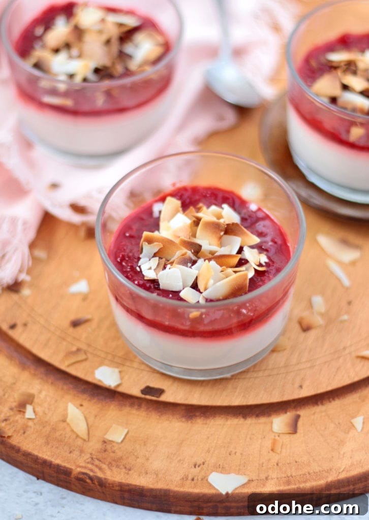 Vegan Coconut Panna Cotta with Fresh Strawberries 6 3 dessert cups over a round wooden board.