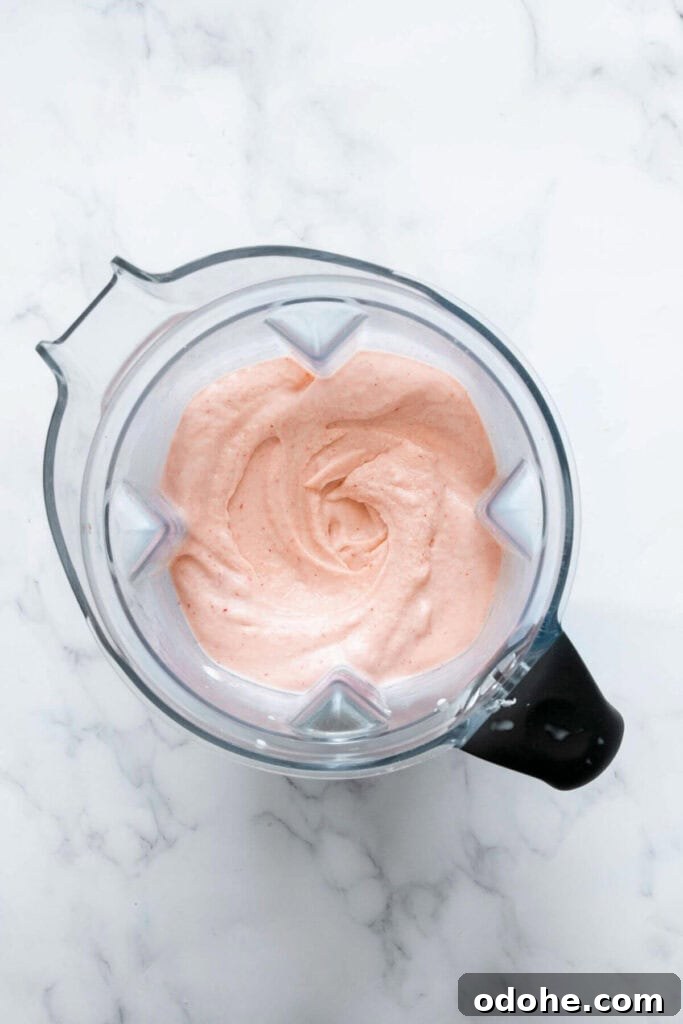 Creamy Banana, Mango & Strawberry Smoothie Recipe 6 banana mango strawberry smoothie in a blender