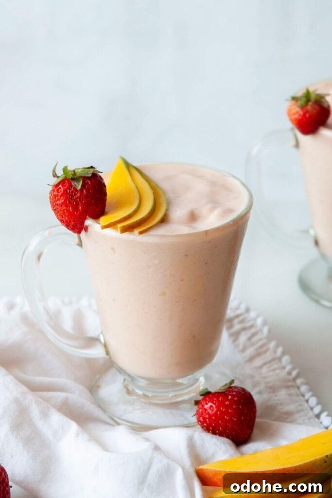 Creamy Banana, Mango & Strawberry Smoothie Recipe 8 creamy protein banana mango strawberry smoothie in a glass