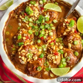 Spicy Thai Peanut Chicken Thighs with Sticky Glaze 12 A white baking dish of spicy peanut butter chicken from above
