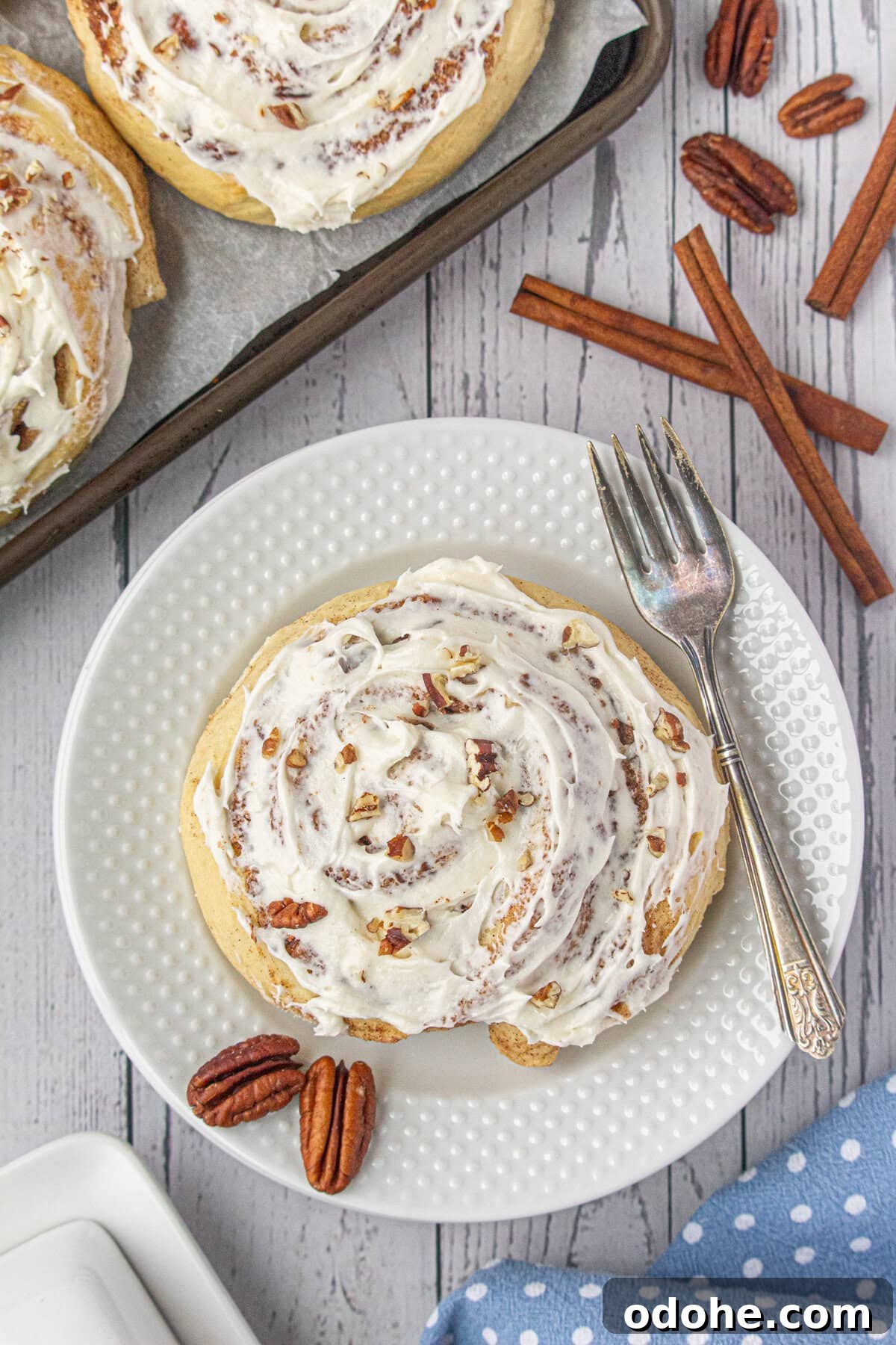 Giant Texas-Style Cinnamon Rolls: Soft, Gooey, Oversized Treat 2 Overhead view of cinnamon rolls on a plate.