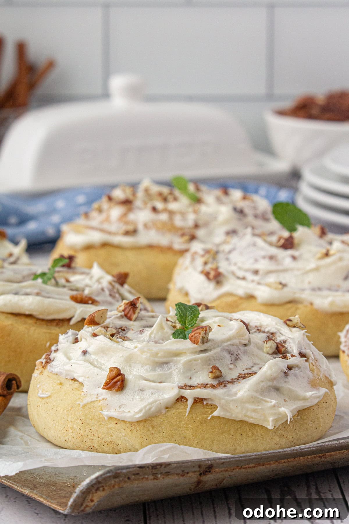 Giant Texas-Style Cinnamon Rolls: Soft, Gooey, Oversized Treat 12 Finished cinnamon rolls covered in frosting.