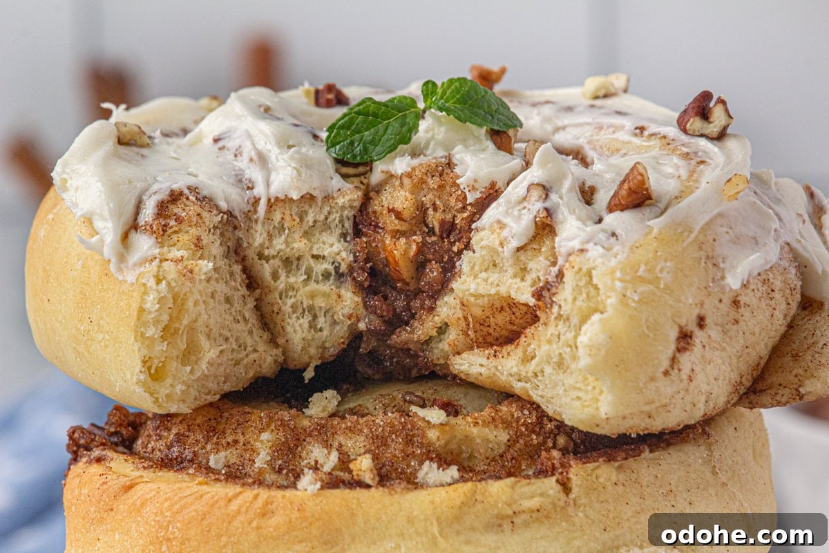 Giant Texas-Style Cinnamon Rolls: Soft, Gooey, Oversized Treat 18 Closeup of a cinnamon roll with a bite removed.