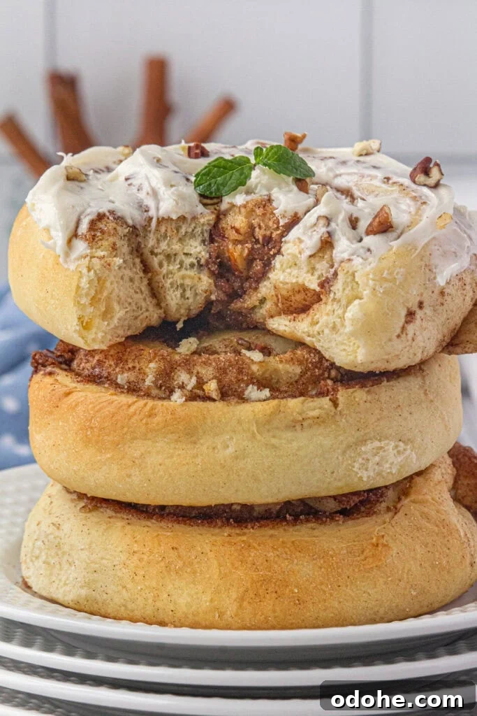 Giant Texas-Style Cinnamon Rolls: Soft, Gooey, Oversized Treat 19 A stack of gooey cinnamon rolls.