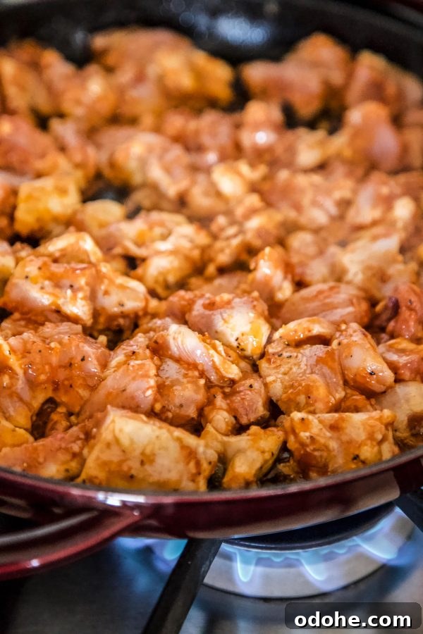 Thai Chicken Totchos: Spicy Peanut Sauce Nacho Bites 5 thai chicken cooking in a skillet