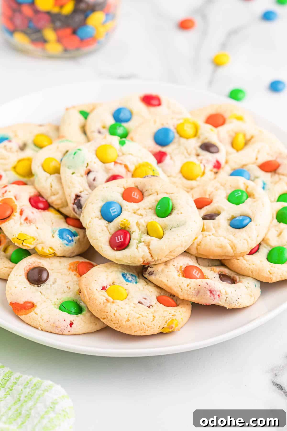 Chewy Cookies Made from White Cake Mix 11 m&m cookies on a white plate